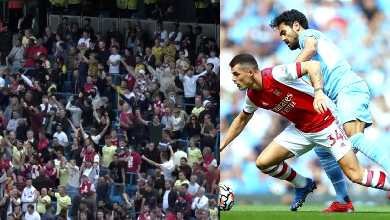 Đám đông cổ động viên Arsenal ăn mừng khi Man City ghi bàn